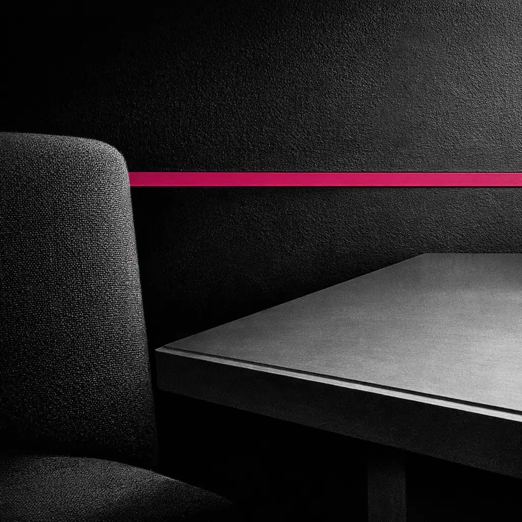 Geometric detail of the card lounge with a magenta accent line