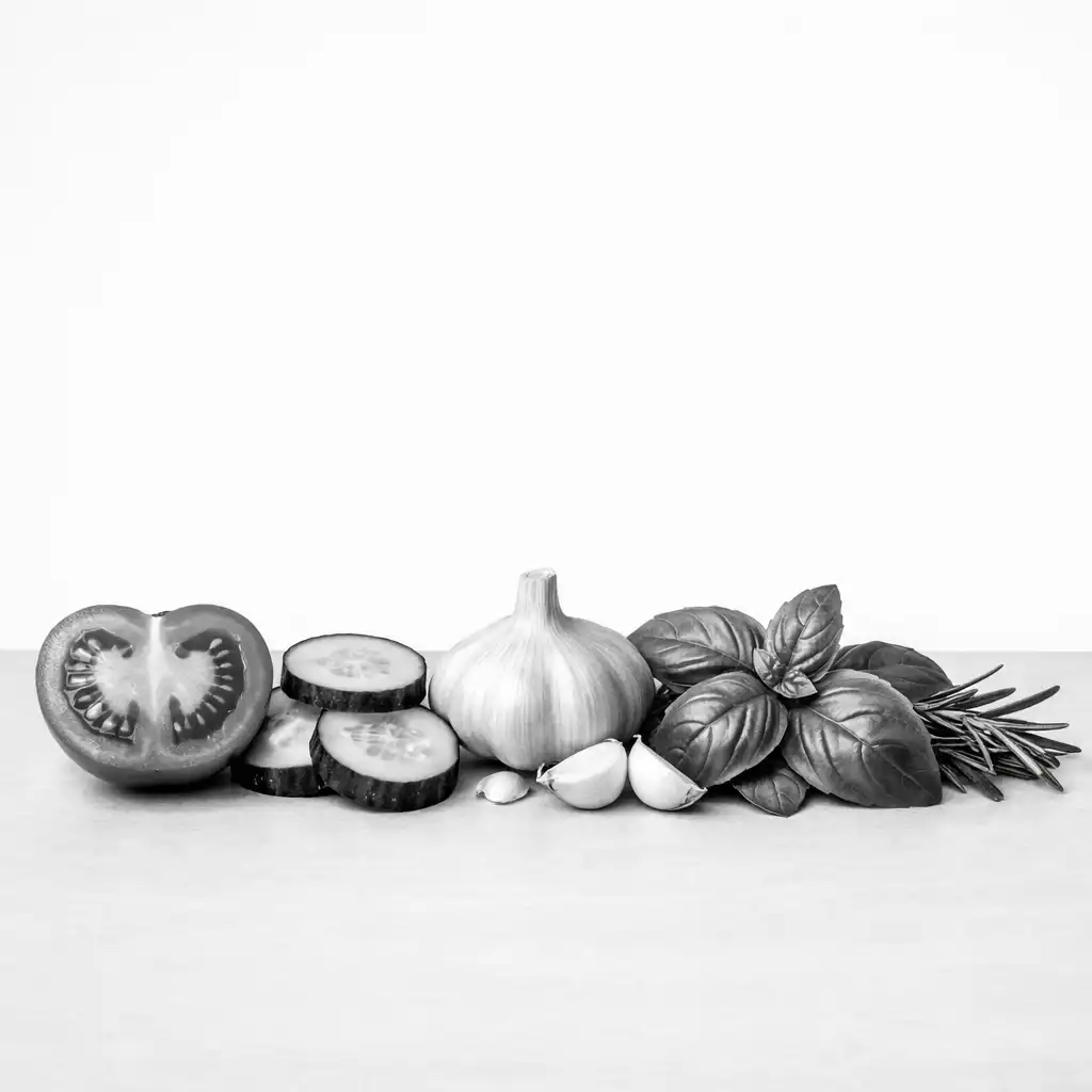 Close-up of fresh vegetables and herbs arranged in a precise row on a light grey surface